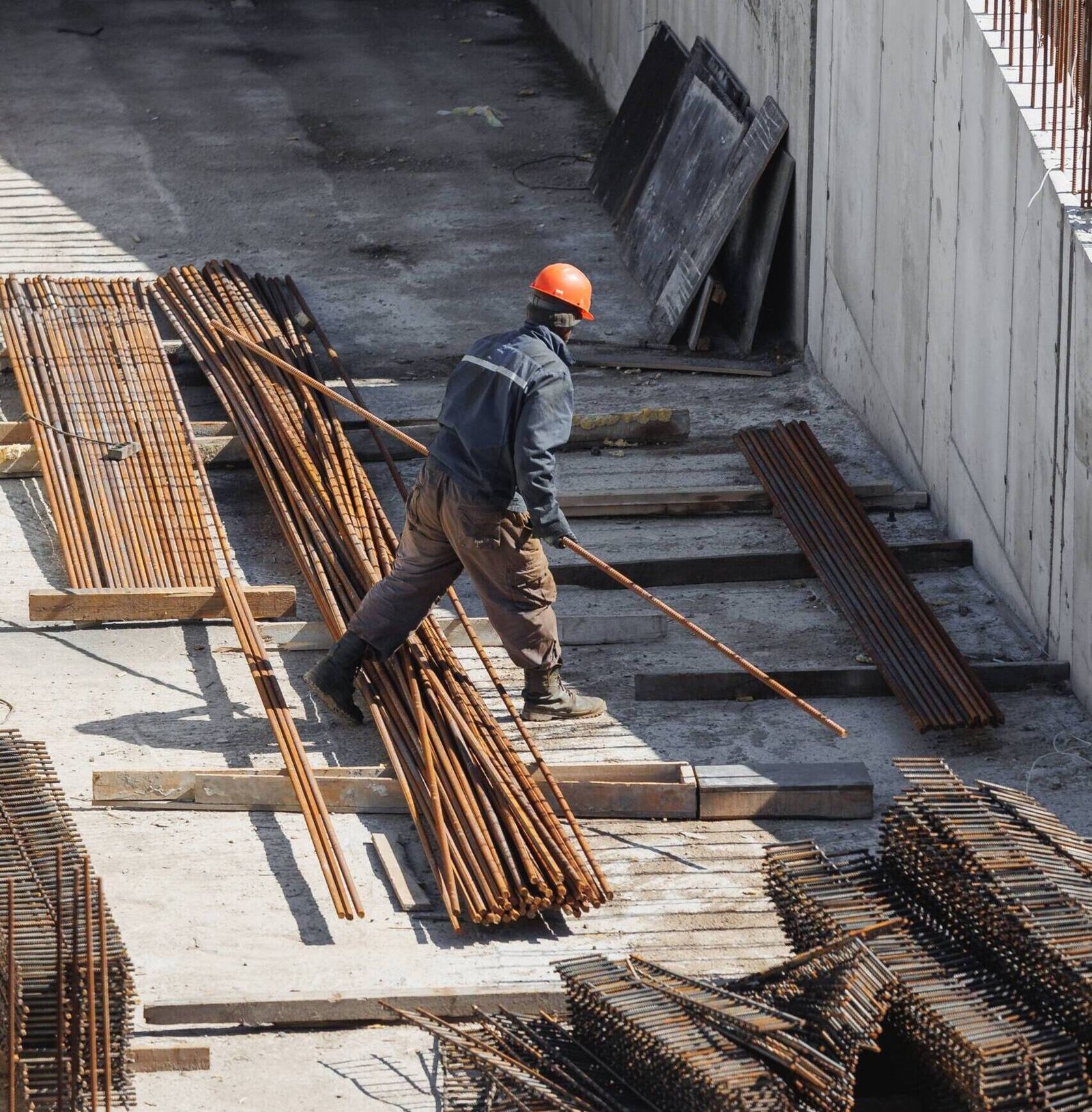 construction-engineer-in-an-orange-helmet-is-worki-2023-11-27-05-35-33-utc